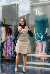 Taupe sleeveless dress with black long-sleeve turtleneck